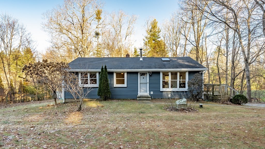 209 Freeman Road Charlton, MA 01507 - Photo 2 of 30 a front view of a house with a yard