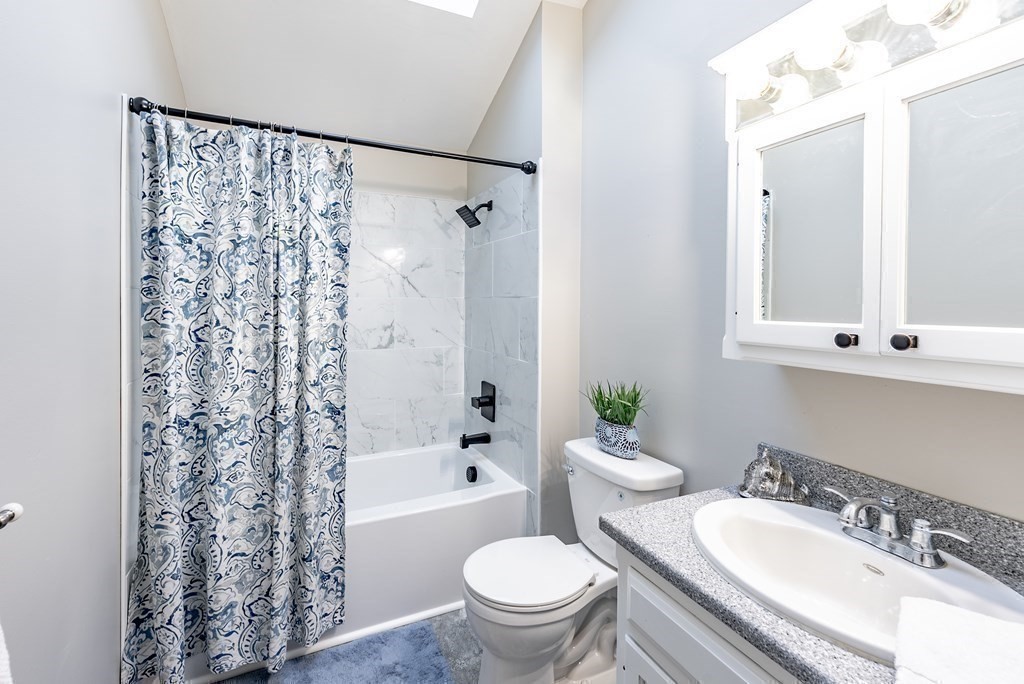 209 Freeman Road Charlton, MA 01507 - Photo 23 of 30 a bathroom with a granite countertop sink toilet and shower
