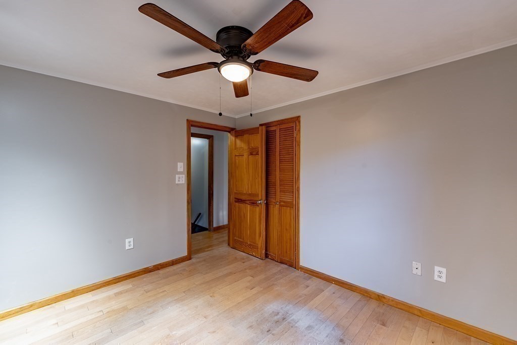 209 Freeman Road Charlton, MA 01507 - Photo 25 of 30 an empty room with closet and a ceiling fan
