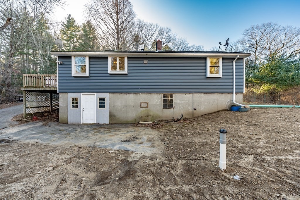 209 Freeman Road Charlton, MA 01507 - Photo 29 of 30 a view of a house with a backyard