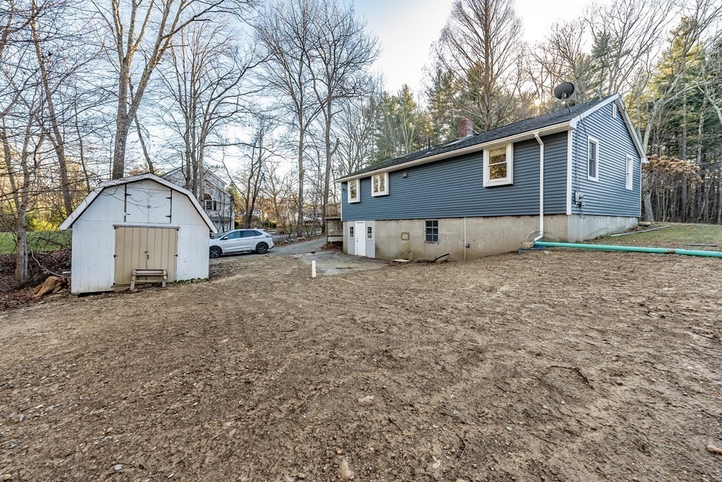 209 Freeman Road Charlton, MA 01507 - Photo 30 of 30 a front view of a house with a yard and garage