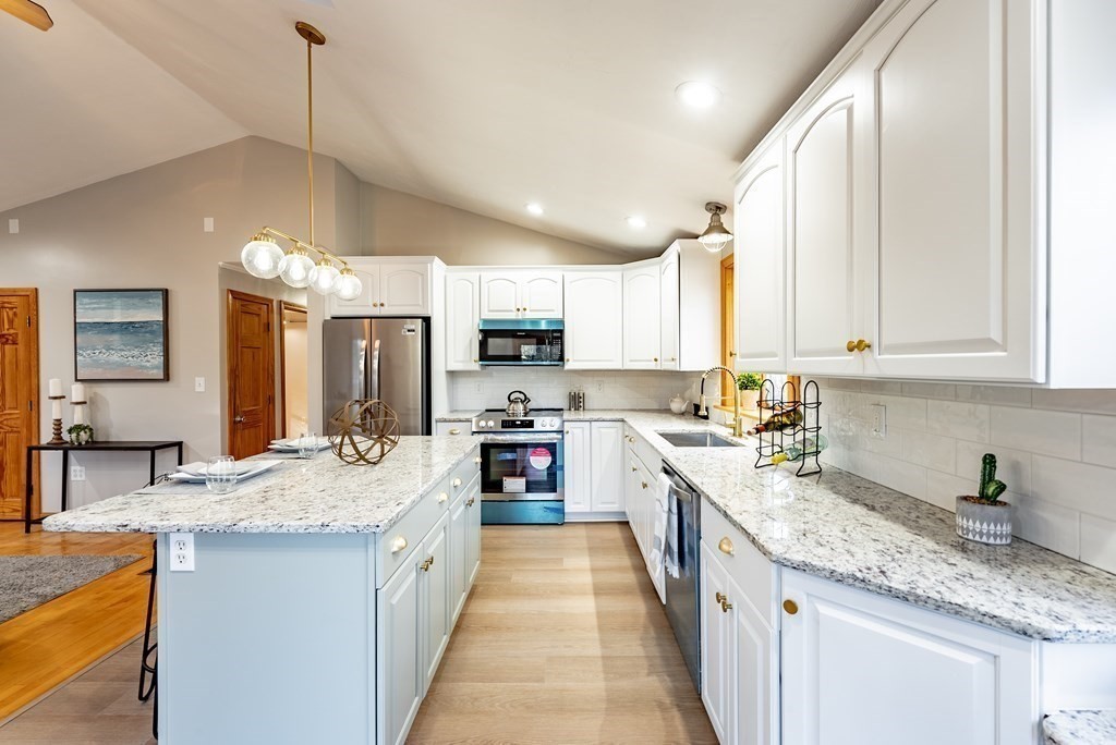 209 Freeman Road Charlton, MA 01507 - Photo 8 of 30 a large kitchen with granite countertop lots of counter space sink and dishwasher