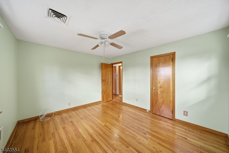 52 Broadway Clark, NJ 07066 - Photo 21 of 47 a view of empty room with wooden floor
