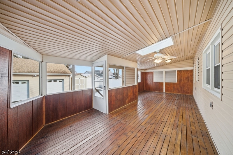 52 Broadway Clark, NJ 07066 - Photo 23 of 47 a view of a porch with wooden floors and stairs