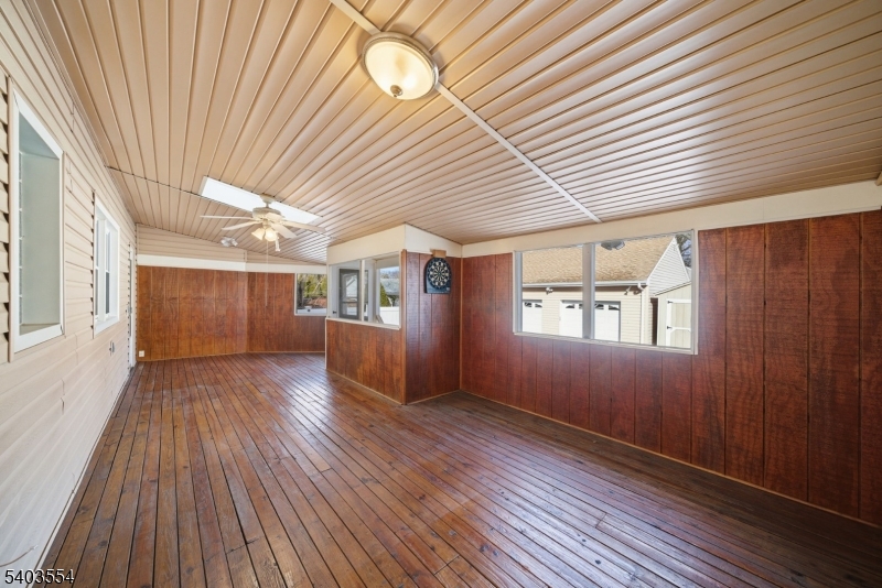 52 Broadway Clark, NJ 07066 - Photo 24 of 47 an empty room with wooden floor and windows