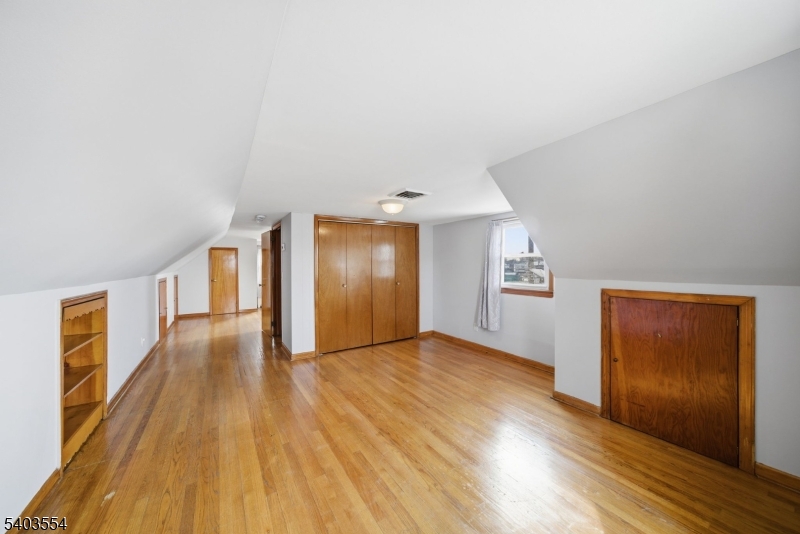 52 Broadway Clark, NJ 07066 - Photo 28 of 47 a view of a hallway with wooden floor