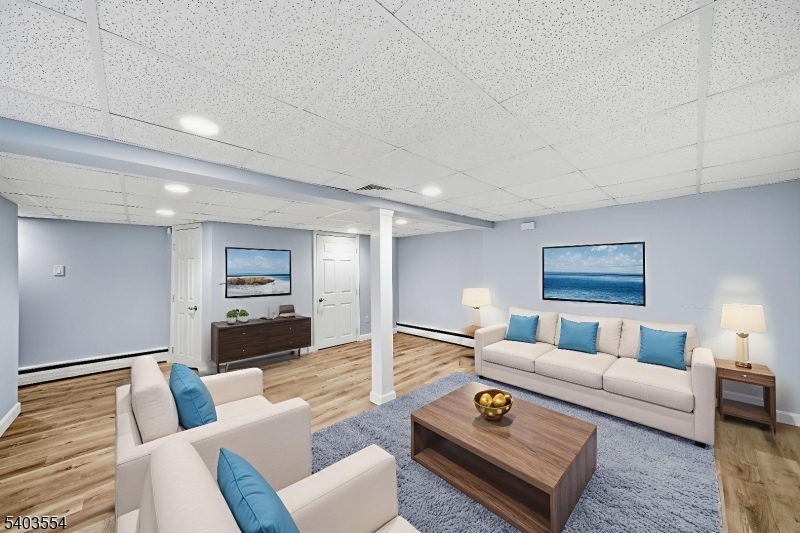 52 Broadway Clark, NJ 07066 - Photo 34 of 47 a living room with furniture and a rug