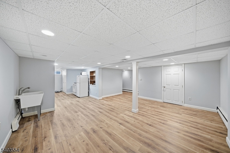 52 Broadway Clark, NJ 07066 - Photo 36 of 47 a view of empty room with wooden floor