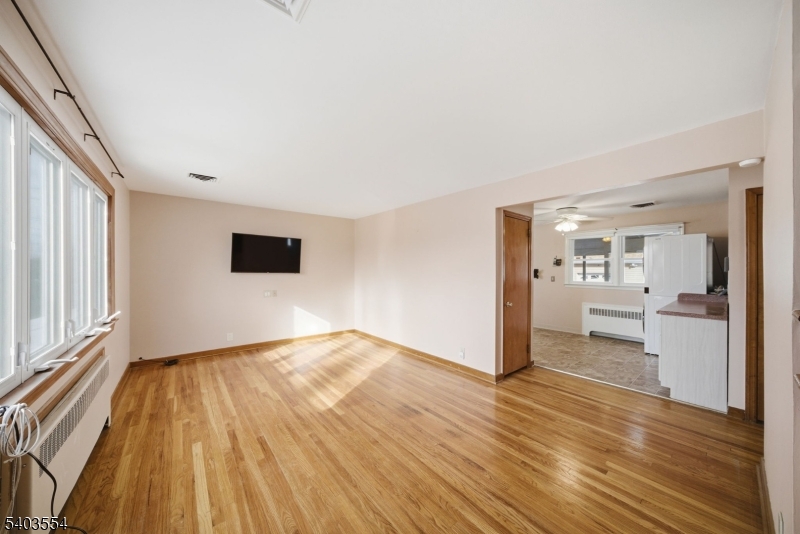 52 Broadway Clark, NJ 07066 - Photo 4 of 47 a view of empty room with wooden floor