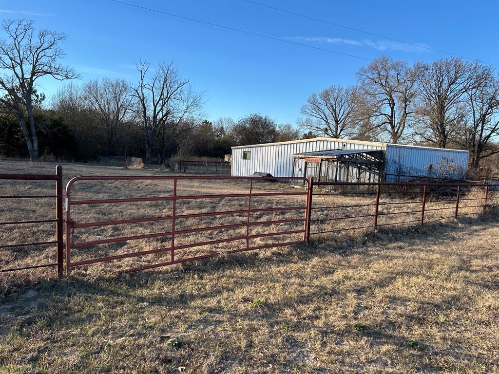 770 Rains County Road 3060 Emory, TX 75440 - Photo 13 of 39 a view of a yard with wooden fence