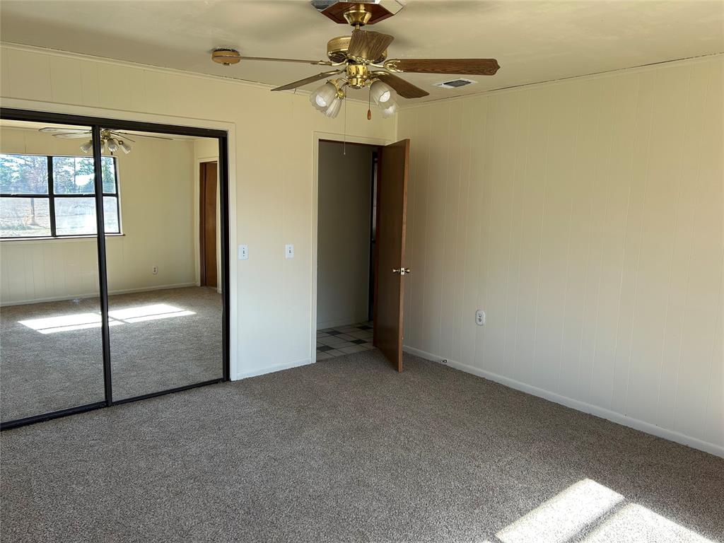 770 Rains County Road 3060 Emory, TX 75440 - Photo 32 of 39 an empty room with a chandelier fan