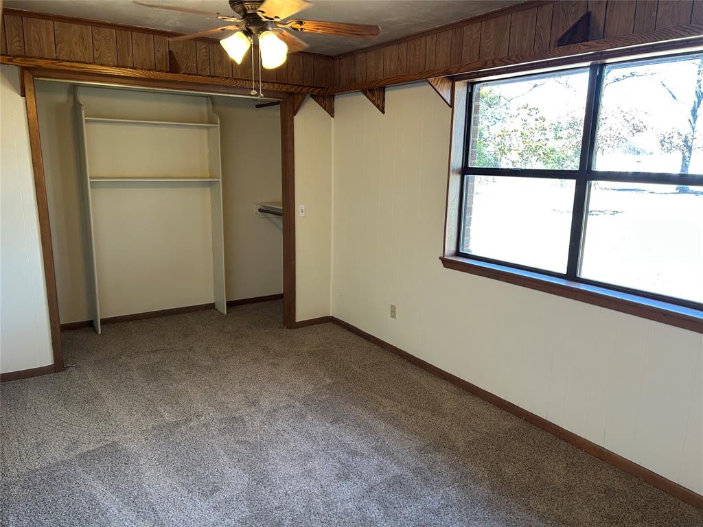 770 Rains County Road 3060 Emory, TX 75440 - Photo 34 of 39 a view of a livingroom with a ceiling fan and window