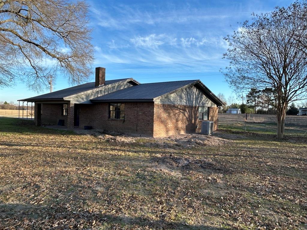 770 Rains County Road 3060 Emory, TX 75440 - Photo 5 of 39 a front view of a house with a yard