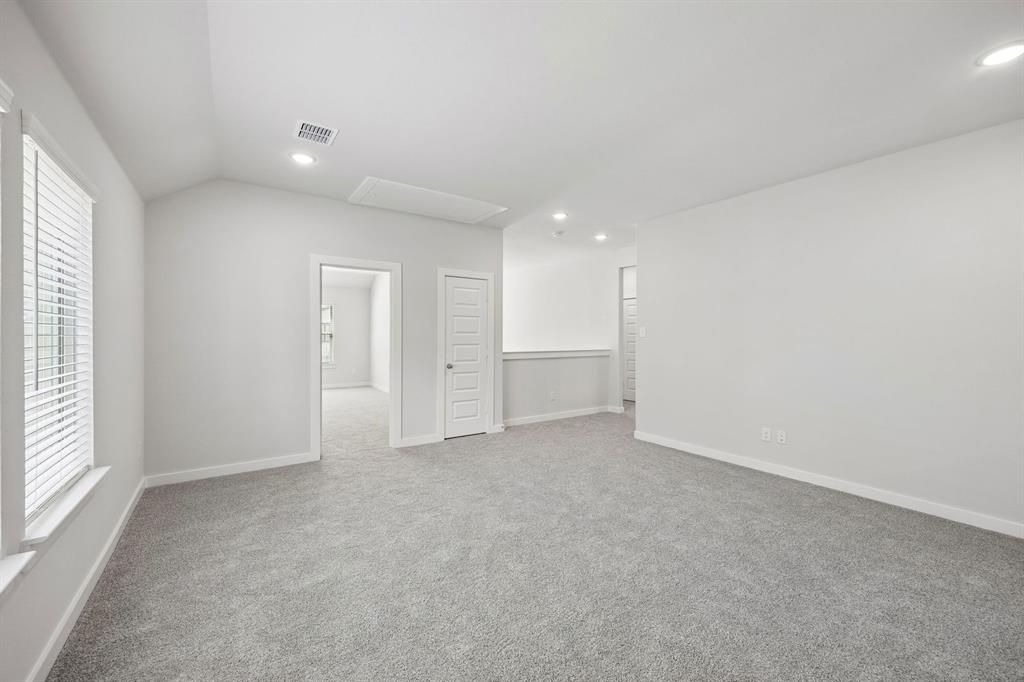 1469 Companero Street Haslet, TX 76052 - Photo 22 of 36 an empty room with windows and closet