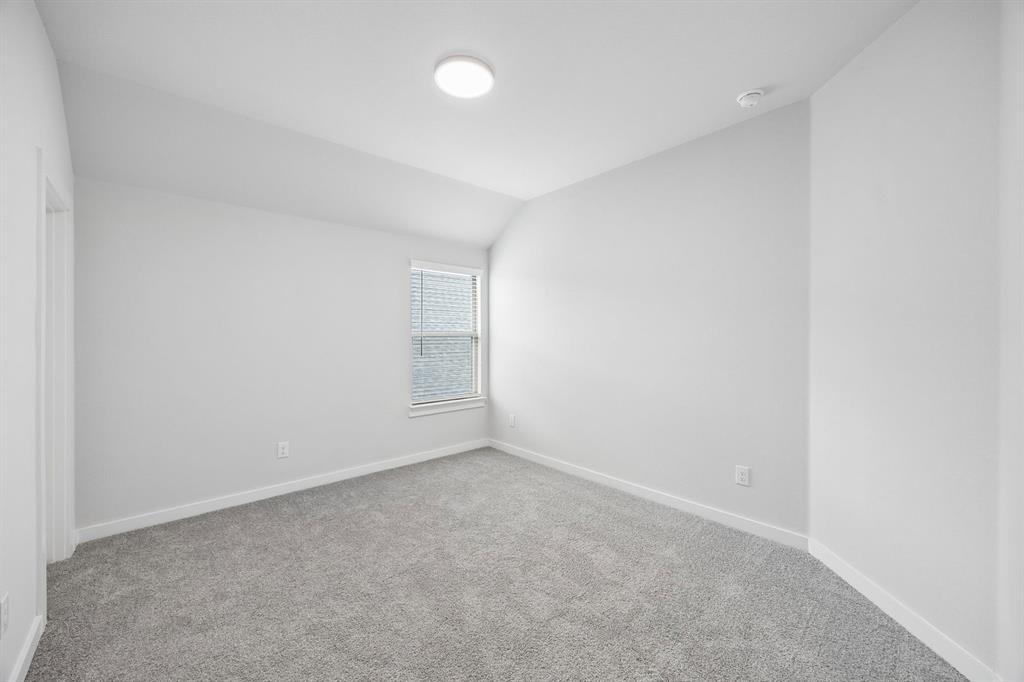 1469 Companero Street Haslet, TX 76052 - Photo 26 of 36 an empty room with a empty space and window