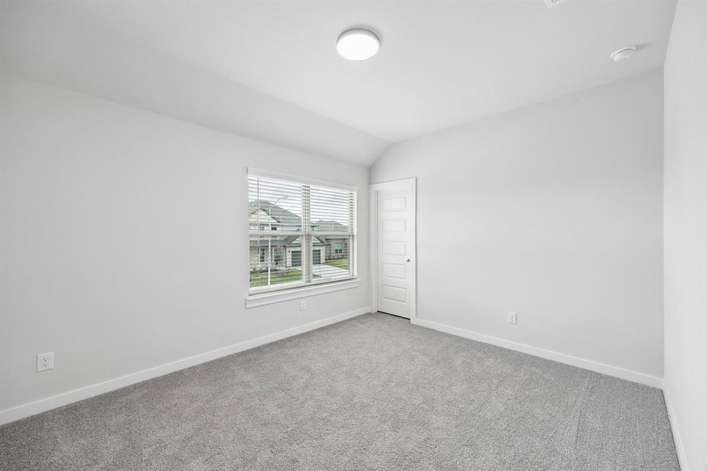 1469 Companero Street Haslet, TX 76052 - Photo 29 of 36 an empty room with windows