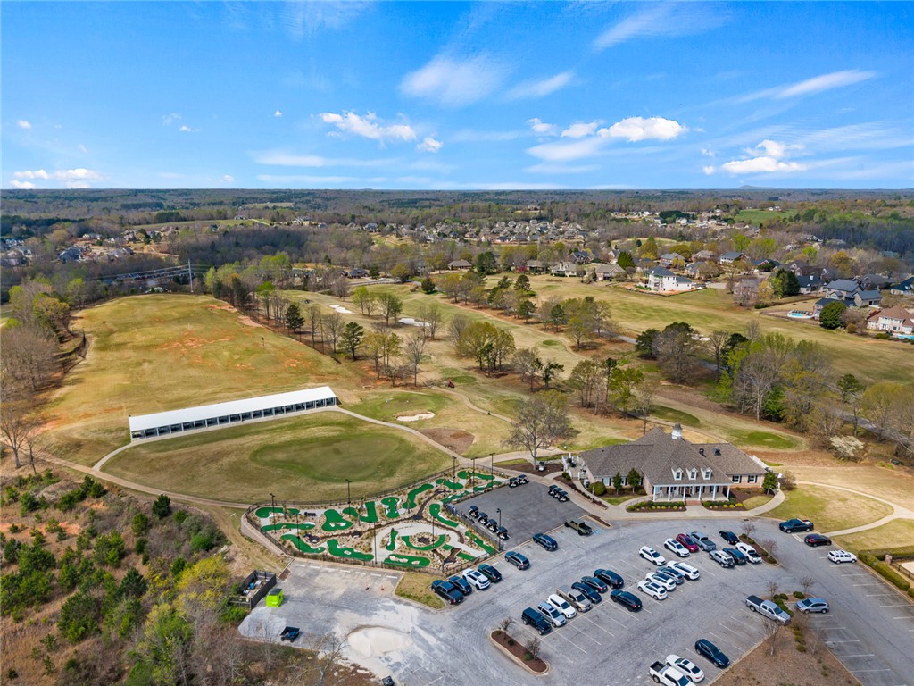 140 Turnberry Road Anderson, SC 29621 - Photo 39 of 44 An aerial view captures a golf course and clubhouse under a clear sky.