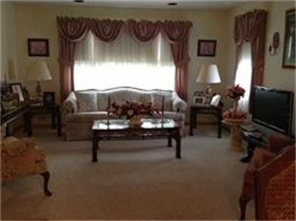 39 Ashmore Road Worcester, MA 01602 - Photo 15 of 24 a living room with furniture and a flat screen tv