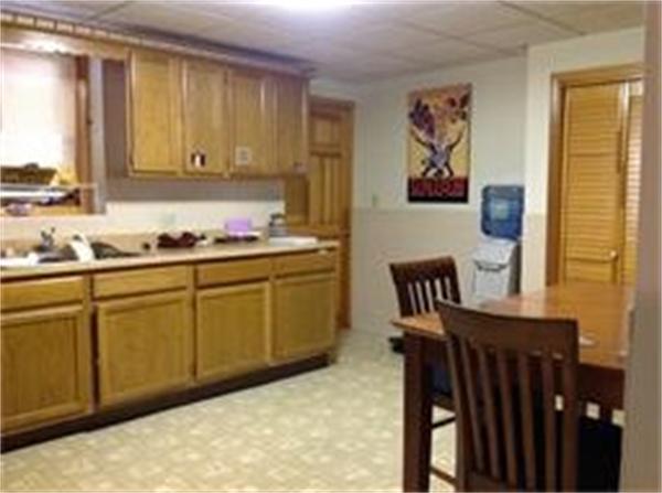 39 Ashmore Road Worcester, MA 01602 - Photo 19 of 24 a kitchen with a sink and cabinets