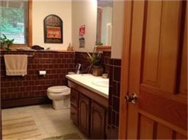 39 Ashmore Road Worcester, MA 01602 - Photo 22 of 24 a bathroom with a toilet a sink and mirror