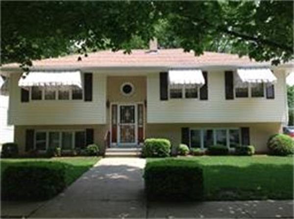 39 Ashmore Road Worcester, MA 01602 - Photo 3 of 24 a view of a house with a garden and yard