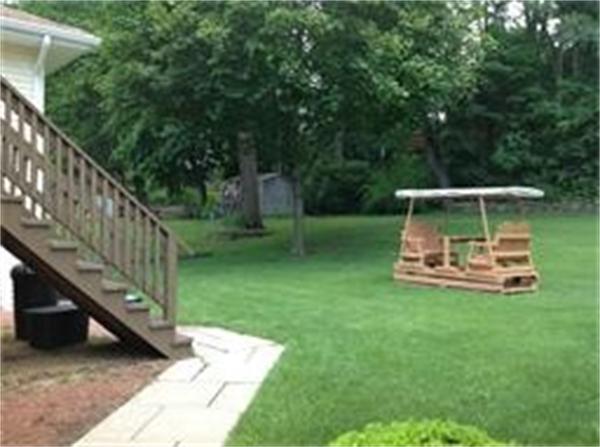 39 Ashmore Road Worcester, MA 01602 - Photo 6 of 24 a view of a chair and table in the garden