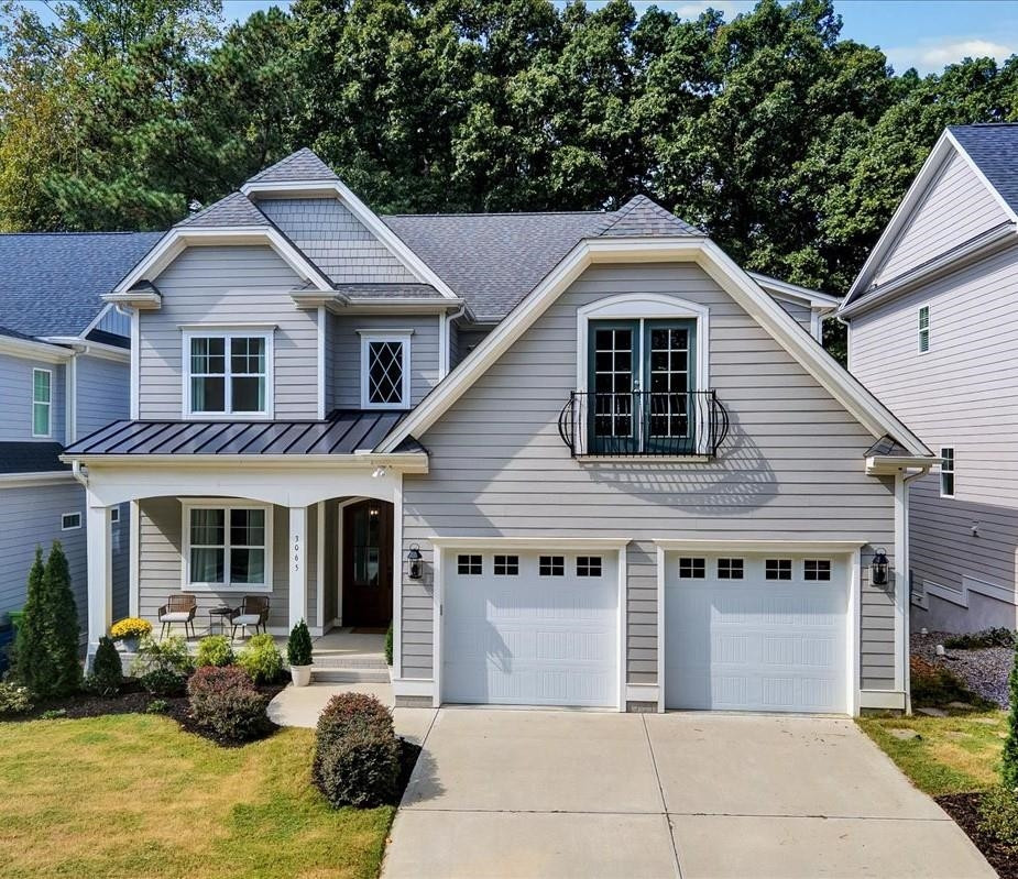 3065 Eden Harbor Court Raleigh, NC 27613 - Photo 1 of 40 a front view of a house with a yard and garage