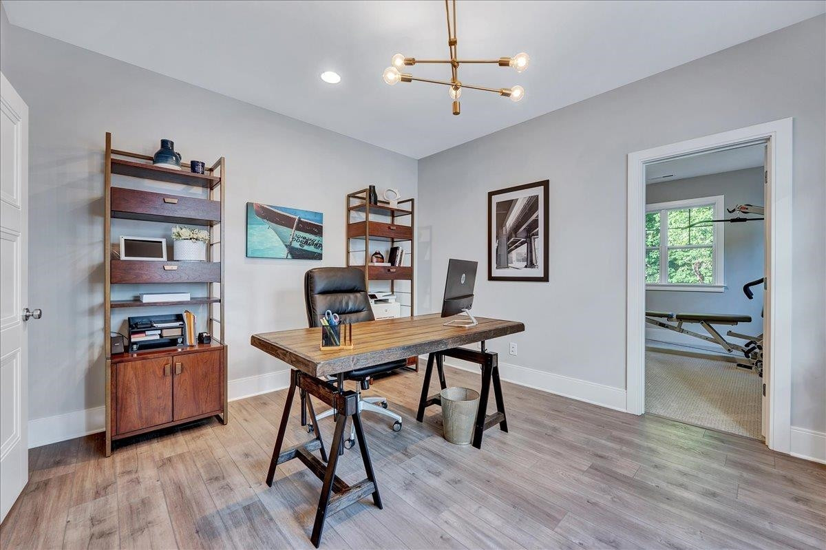 3065 Eden Harbor Court Raleigh, NC 27613 - Photo 25 of 40 a workspace with furniture wooden floor and a window