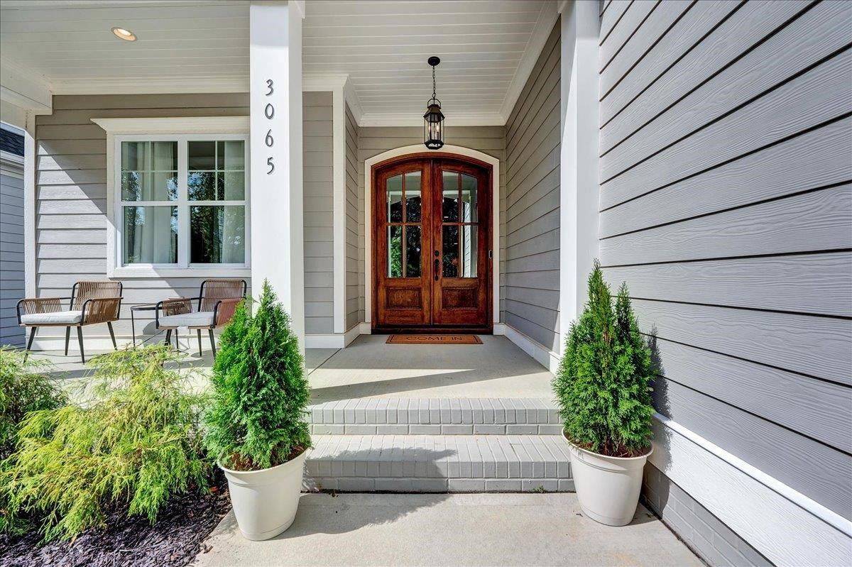 3065 Eden Harbor Court Raleigh, NC 27613 - Photo 3 of 40 a front view of a house with a garden