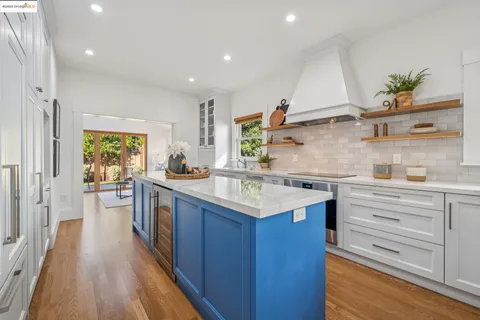 a kitchen with stainless steel appliances granite countertop a sink and cabinets