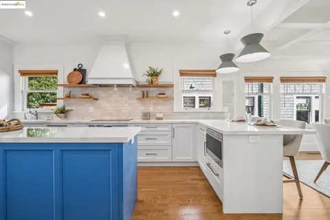 a kitchen with a stove and cabinets