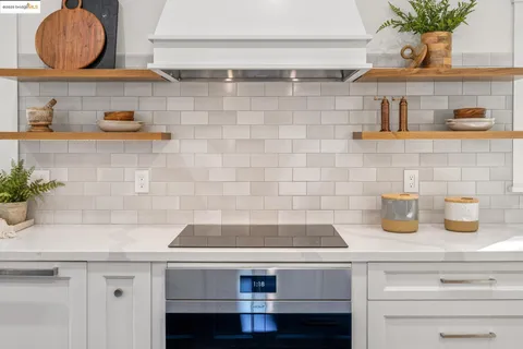 a kitchen with a sink stove and refrigerator
