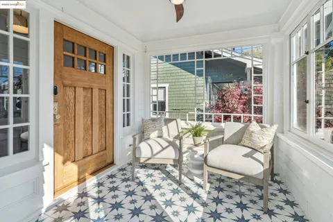 a living room with furniture a rug and a window