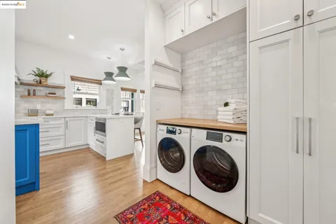 a bathroom with a granite countertop tub a sink and a mirror