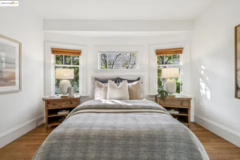 a view of bathroom with tub and mirror