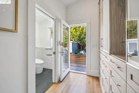 a view of a patio with a table chairs and a fire pit