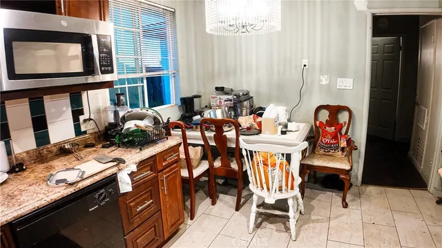 a dining room with furniture and window