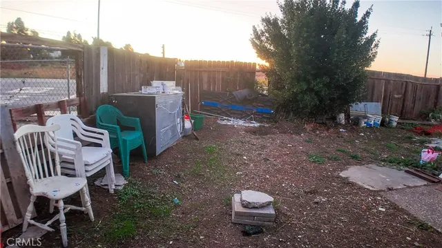 a view of a backyard with furniture