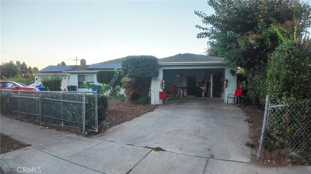 a view of a front of a house with potted plants
