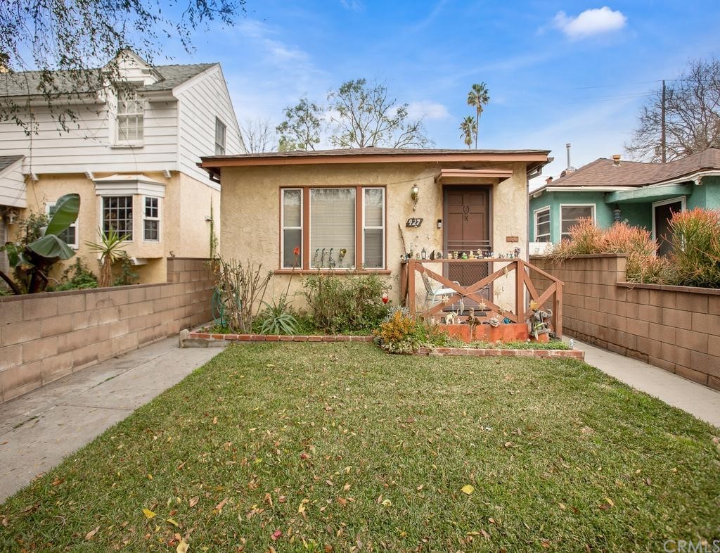 front view of a house with a yard