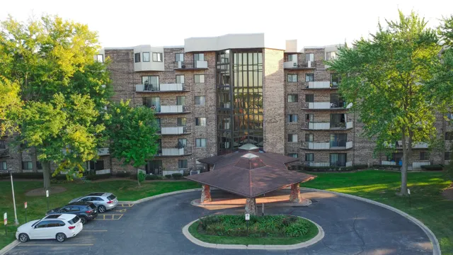 a lake view with a garden and lots of trees