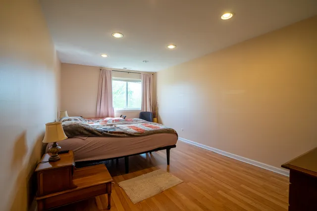 a view of a room with furniture and wooden floor