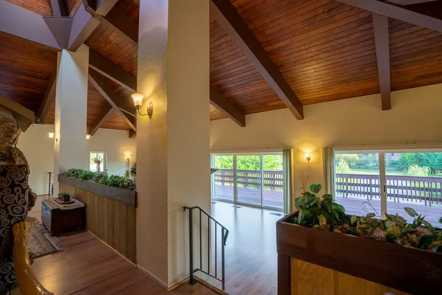 a view of balcony with wooden floor