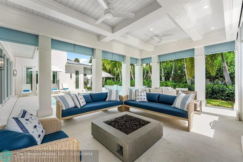 1122 Miramar Drive Delray Beach, FL 33483 - Photo 16 of 44 a living room with furniture and a large window
