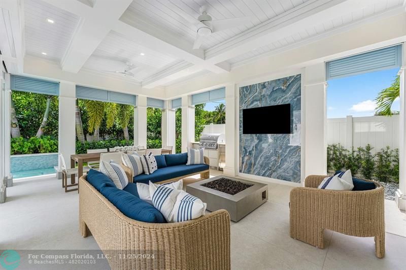 1122 Miramar Drive Delray Beach, FL 33483 - Photo 17 of 44 a living room with furniture and a flat screen tv