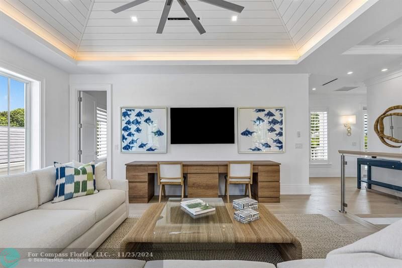 1122 Miramar Drive Delray Beach, FL 33483 - Photo 25 of 44 a living room with furniture a flat screen tv and a table