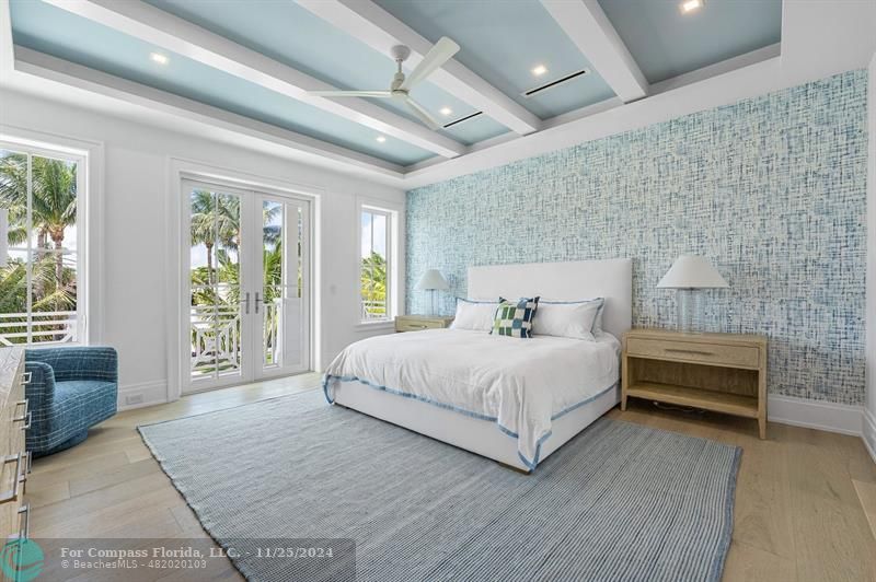 1122 Miramar Drive Delray Beach, FL 33483 - Photo 28 of 44 a spacious bedroom with a large bed and a couch