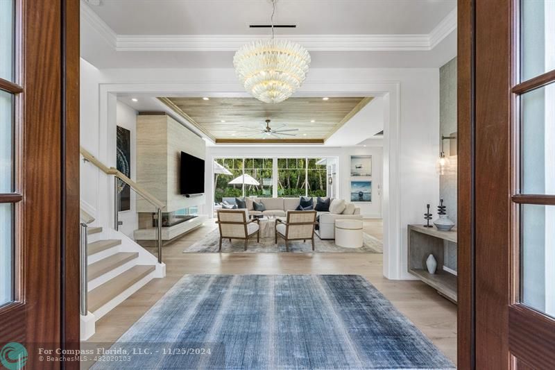 1122 Miramar Drive Delray Beach, FL 33483 - Photo 3 of 44 a view of a living room with wooden floor and a chandelier