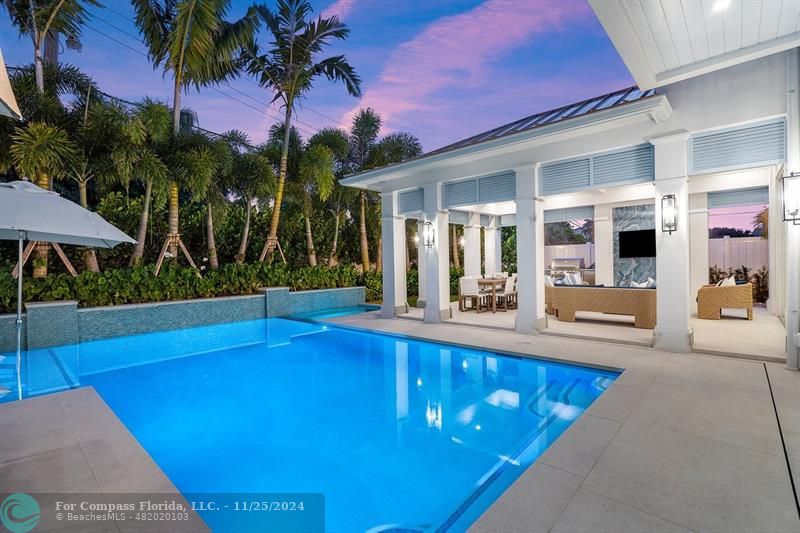 1122 Miramar Drive Delray Beach, FL 33483 - Photo 36 of 44 a view of a swimming pool with a patio