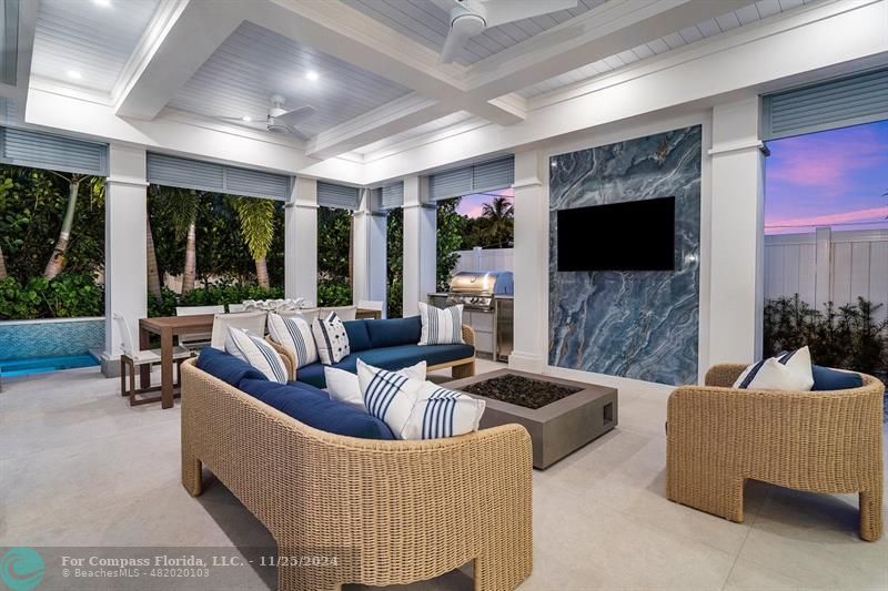 1122 Miramar Drive Delray Beach, FL 33483 - Photo 39 of 44 a living room with furniture and a flat screen tv